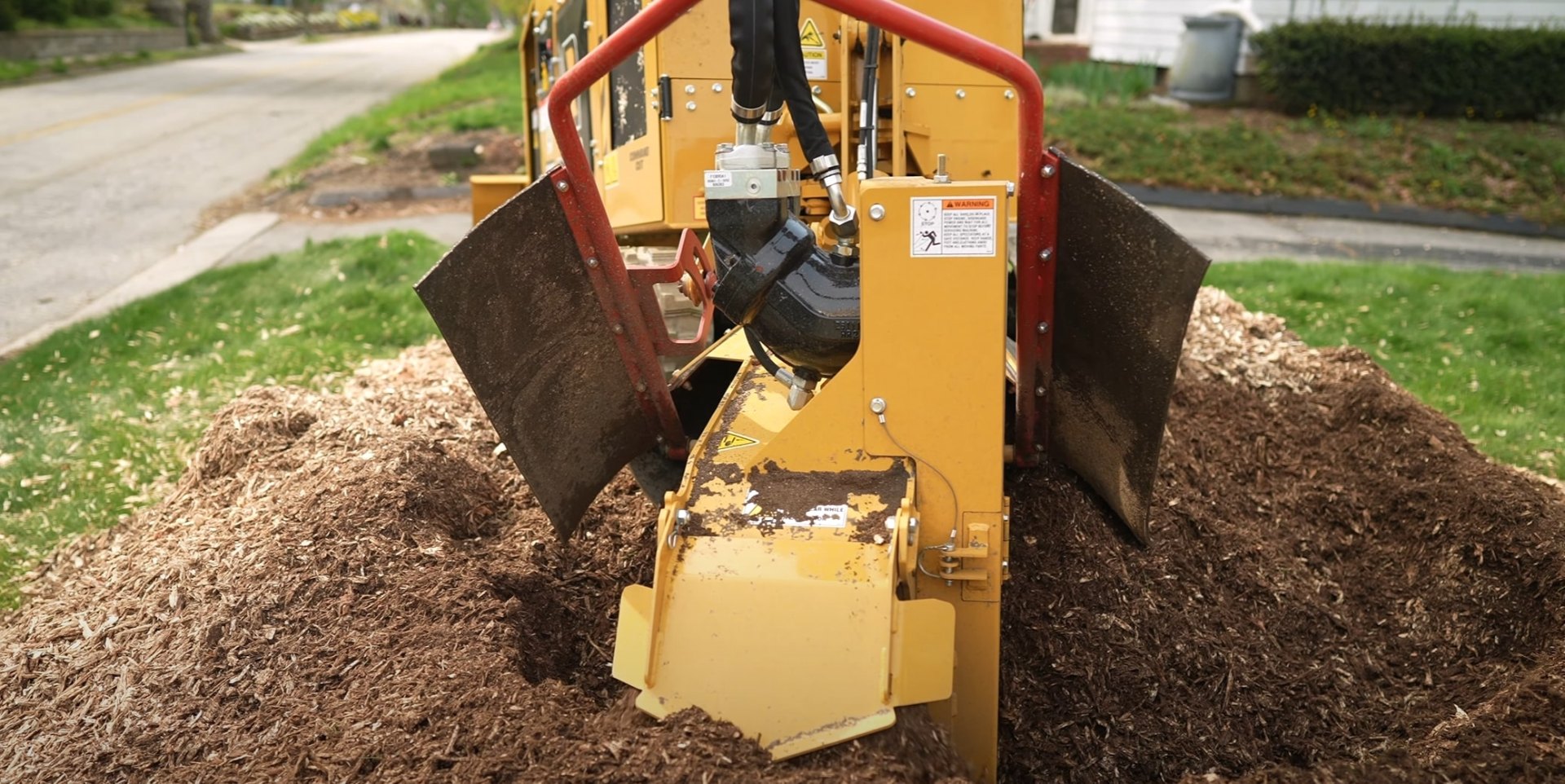 Stump Grinding Services - Portsmouth Tree Services Professional stump grinder creating mulch from tree stumps