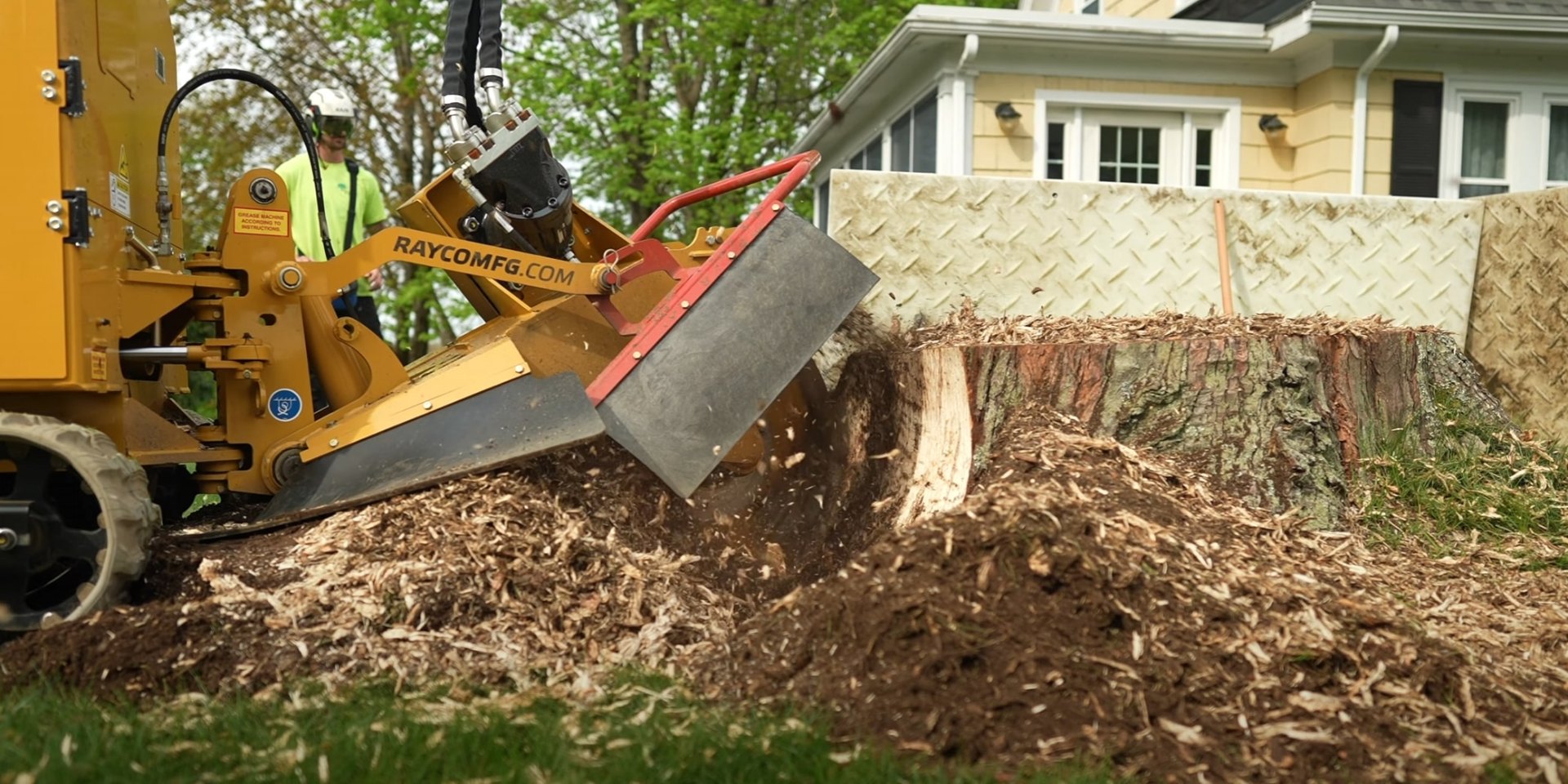 Stump grinding equipment clearing large tree stump